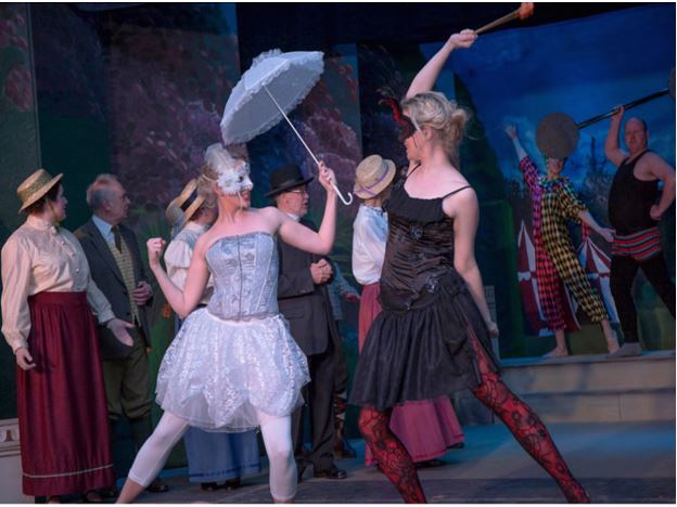 MPO's Spring Fate in performance last year. Writer, composer director Neil Edwards is the man flexing his muscles in the background on the right